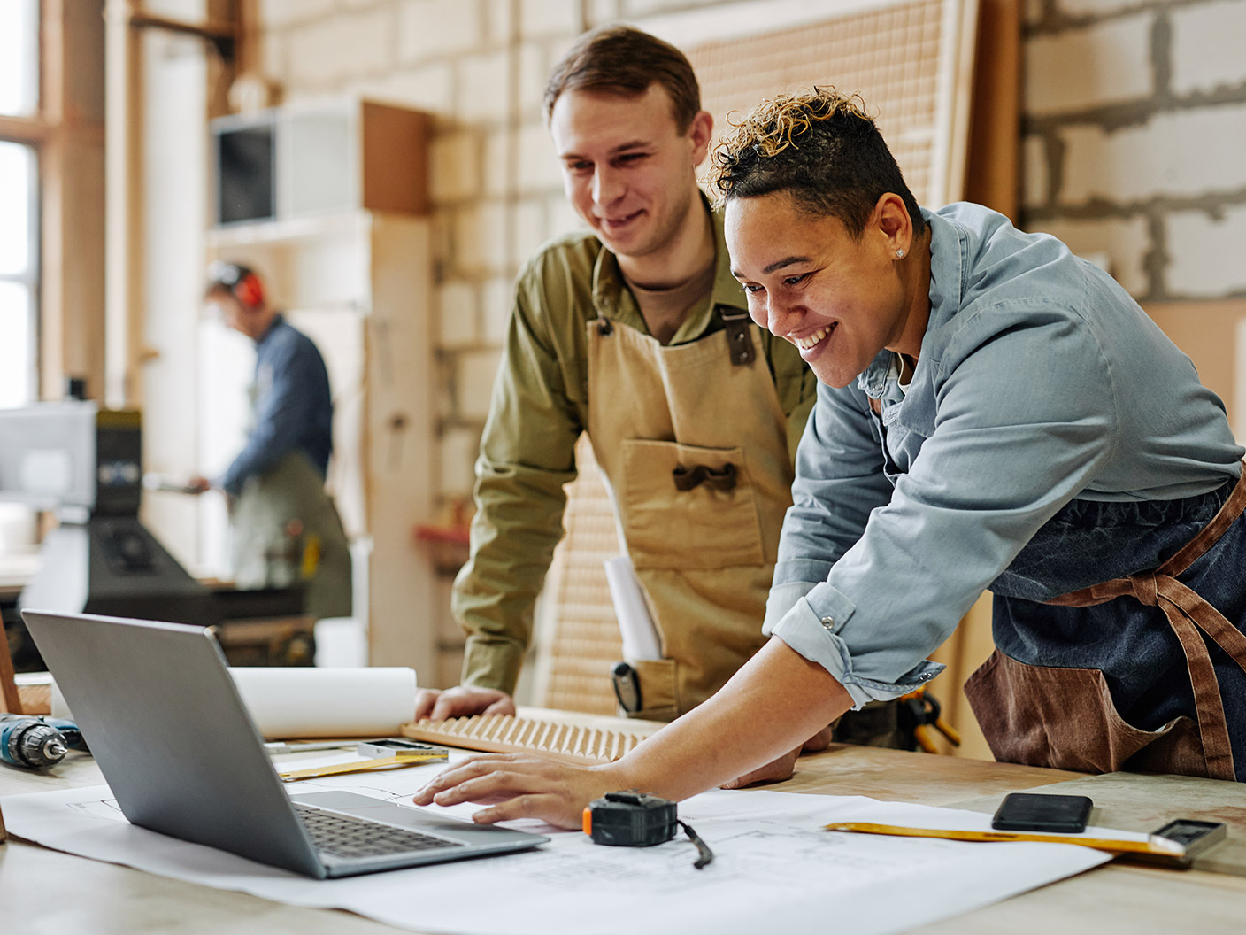 two people using laptop