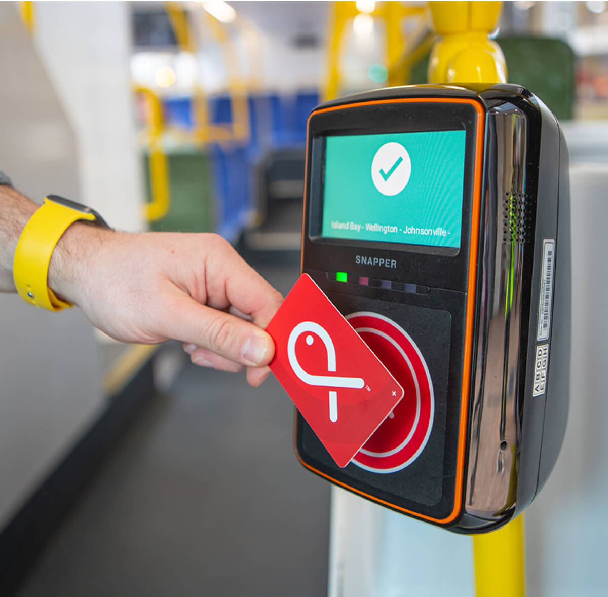 Snapper card being scanned while getting on a bus