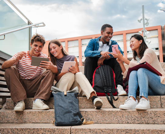 Image of students sitting on stairs outside