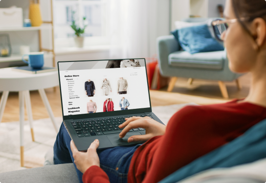 Image of a woman sitting on her couch at home online shopping