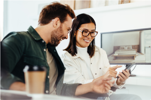 Man and a woman looking at a mobile phone