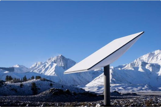 image of starlink satellite with a snowy mountain range in the background